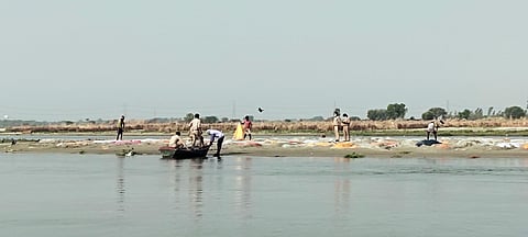 Bodies of suspected Covid patients found in Ganga cremated by the administration, in Unnao. (Photo | ANI)