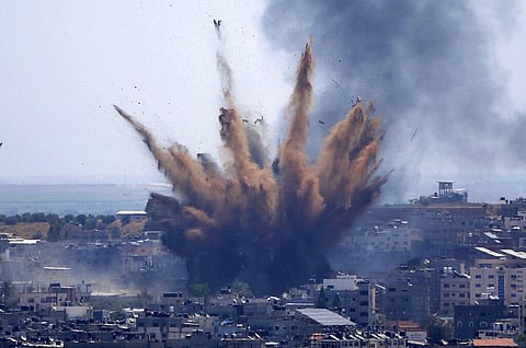 Smoke rises following Israeli airstrikes on a building in Gaza City on Thursday. (Photo | AP)
