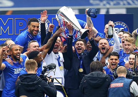 Rangers manager Steven Gerrard and the team celebrate winning the Scottish Premiership after the match against Aberdeen (Photo | AP)