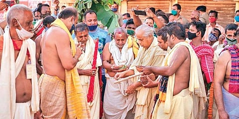 Priests performing rituals at the chariot construction yard in Puri. (Photo | EPS)
