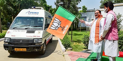 BJP president JP Nadda with MOS Anurag Thakur flags off relief materials for Himachal Pradesh from his residence in New Delhi on Sunday. (Photo | PTI)