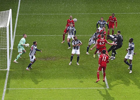 Liverpool's goalkeeper Alisson, second right, scores his side's second goal during the English Premier League soccer match between West Bromwich Albion and Liverpool  (Photo | AP)