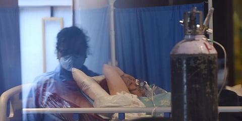 A COVID-19 patient undergoes treatment at Shehnai Banquet Hall isolation centre, in New Delhi. (Photo | PTI)