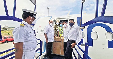 MAUD Minister KT Rama Rao, along with Chief Secretary Somesh Kumar, receives the oxygen concentrators donated by  Greenko  at the Shamshabad Airport in Hyderabad on Sunday.
