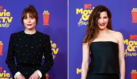 Elizabeth Olsen & Kathryn Hahn pose for photos as they win awards for 'Wandavision' at the 2021 MTV movie and tv awards. (Photo | @MTV, Twitter)