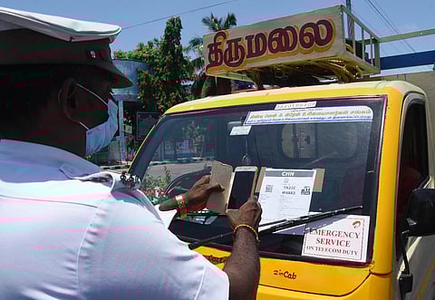 A traffic policeman checking a vechicle at Thoraipakkam OMR on Tuesday. Express/ Ashwin Prasath