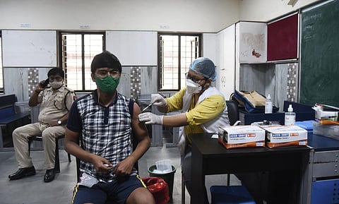 A beneficiary above 18 years old gets the COVID-19 vaccine, at a government school (COVID-19 Centre) in New Delhi on Tuesday. (Photo | Parveen Negi, EPS)