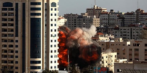 An Israeli air strike hits a building in Gaza City. (Photo | AP)