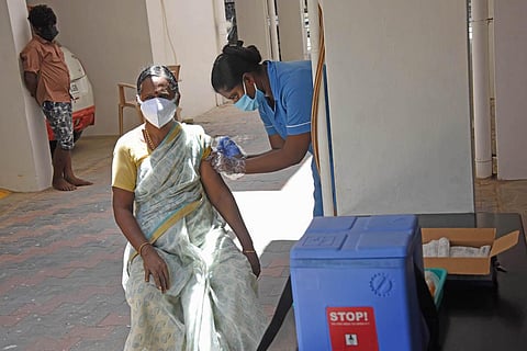 A woman getting vaccinated at an apartment complex in LIC Nagar, Madipakkam, Chennai. (Photo | Ashwin Prasath, EPS)