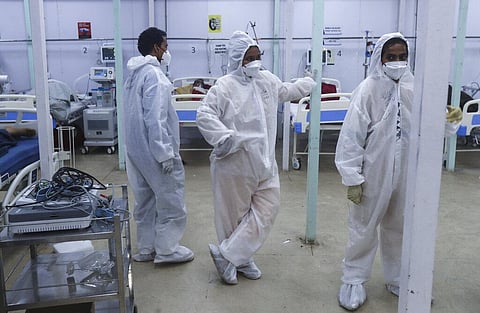 Health workers keep a watch on patients in a ward at the BKC jumbo field hospital, one of the largest COVID-19 facilities in Mumbai. (File photo| AP)