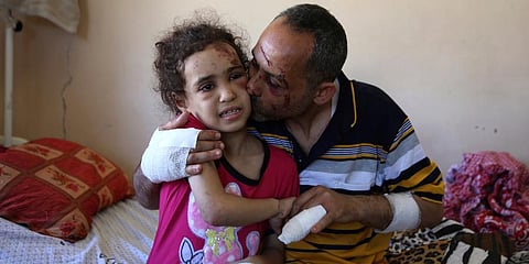 Suzy and her father Riad were the only survivors of their family after an Israeli airstrike destroyed one of the buildings they lived in Gaza City, killing her mother and four siblings. (Photo | AP)