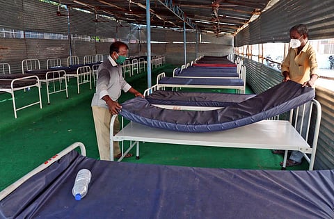 Workers prepare beds at a Covid care centre. (Representational Photo | Express)