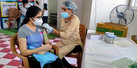 A woman receives the COVID-19 vaccine in Thane. (Photo| ANI)