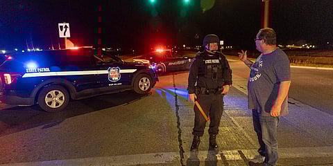 A State Patrol officer blocks the road in front of the Oneida Bingo and Casino in Green Bay, Wisconsin. (Photo| AP)