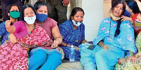 File photo of family members of the Covid-19 patients who lost their lives owing to a lack of oxygen, grieve outside the Chamarajanagar District Hospital. (File photo| Udayashankar S, EPS)