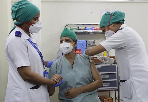A health worker receives a dose of COVAXIN vaccine for COVID-19 at a vaccination centre in Mumbai. (Photo | AP)