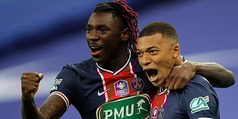 Kylian Mbappe celebrates with Moise Kean after scoring his side's second goal during the French Cup final between Paris Saint Germain and Monaco at the Stade de France stadium. (Photo | AP)