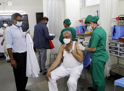 An elderly person receives a dose of COVAXIN vaccine for COVID-19 at a vaccination centre in Mumbai. (Photo | AP)
