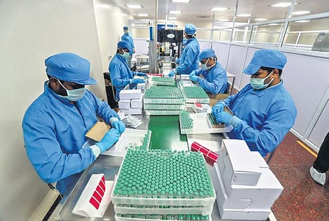 In this file photo, employees pack boxes containing vials of Covishield, a version of the AstraZeneca vaccine, at the Serum Institute of India in Pune | AP