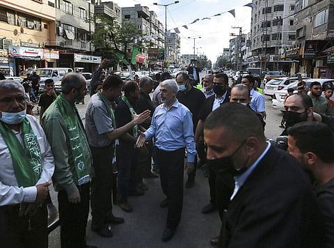 Top Hamas leader in Gaza, Yehiyeh Sinwar, center, pays his respects at a house of mourning for a Hamas commander killed in the war, in Gaza City, Saturday, May 22, 2021. (Photo | AP)
