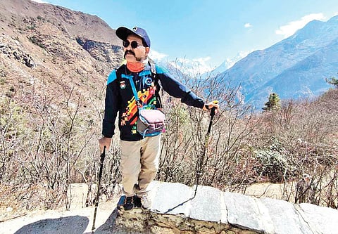 In an earlier expedition, Dharmshaktu heading from Dingboche in Nepal to scale Mt. Everest