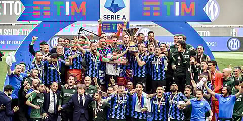Inter Milan players celebrate with the trophy after clinching the Serie A title. (Photo | AP)