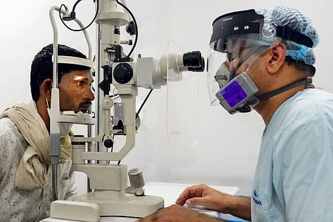 Dr. Vijay Gakhar attends to a patient suspected to have been infected with mucormycosis, at a hospital in Ajmer, Tuesday, May 24, 2021. (Photo | PTI)