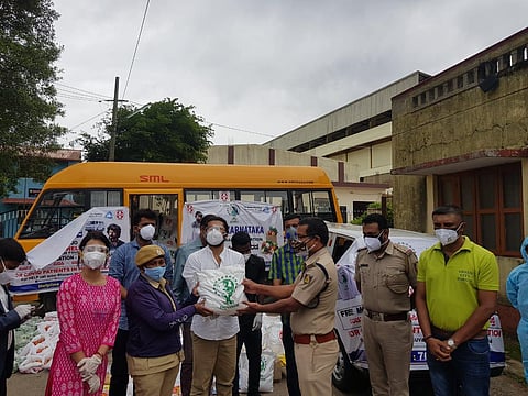 Food kits were distributed in Madikeri Mann's Compound Ground on Tuesday (Photo | Special arrangement)