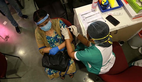 A beneficiary receives a dose of the COVID-19 vaccine. (Photo | Shekhar Yadav, EPS)