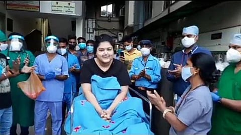 Hospital staffers shower flowers on Rupali Srivastava upon her discharge. (Photo | Special arrangement)