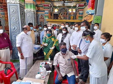 Puducherry LG Dr Tamilisai Soundararajan launching Covid-free villages programme at a temple in Vaithikuppam fishing village along with Protem Speaker K Lakshminarayanan (Photo | Special arrangement)