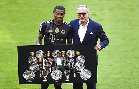 Bayern's David Alaba, left, poses with Bayern Munich CEO Karl Heinz Rummenigge prior to the start of the Bundesliga soccer match between Bayern Munich and FC Augsburg. (Photo | AP)