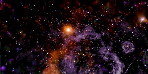 This false-color X-ray and radio frequency image made available by NASA shows threads of superheated gas and magnetic fields at the center of the Milky Way galaxy. (Photo | AP)