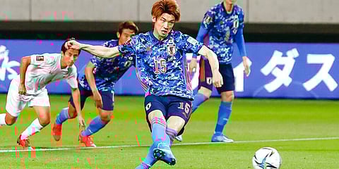 Japan's Yuya Osako (C) scores a goal on penalty kick against Myanmar during their Asian qualification match for the FIFA World Cup Qatar 2022. (Photo | AP)