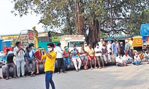 Farmers stage a rasta roko at Chinna Gottimukkula in Sivampet mandal, on Friday