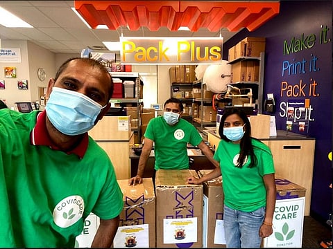 The members of the voluntary group along with the oxygen concentrators they sent to India.