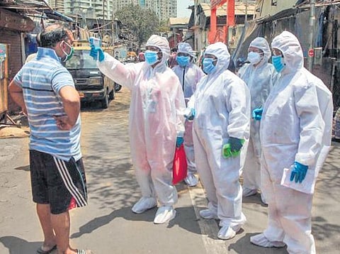 Health workers screen temperature in a safety drive in Mumbai. (File Photo)