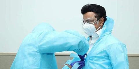 Tamil Nadu CM MK Stalin dons a PPE kit before visiting the COVID treatment ward at Government Medical College and ESIC Hospital in Coimbatore. (Photo| EPS)
