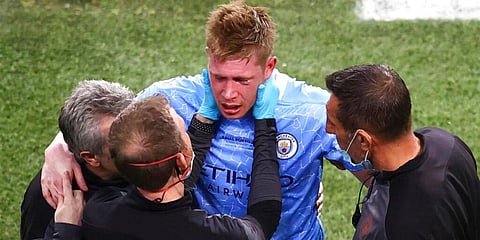 Manchester City's Kevin De Bruyne is assisted after a foul by Chelsea's Antonio Rudiger during the Champions League final. (Photo | AP)