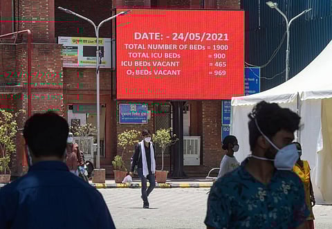 A digital display board showing availability of number of beds at COVID designated LNJP Hospital, in New Delhi. (Photo | PTI)