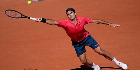 Switzerland's Roger Federer plays a return to Uzbekistan's Denis Istomin during French Open. (Photo | AP)