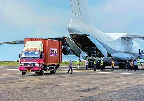 The oxygen cylinders being unloaded from a special flight at Biju Patnaik International Airport in Bhubaneswar. (Photo| EPS)