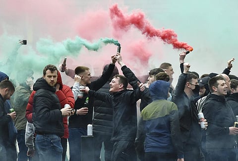 Manchester United fans protest outside the Lowry Hotel where team was staying during a protest against the Glazer family, owners of Manchester United (Photo | AP)