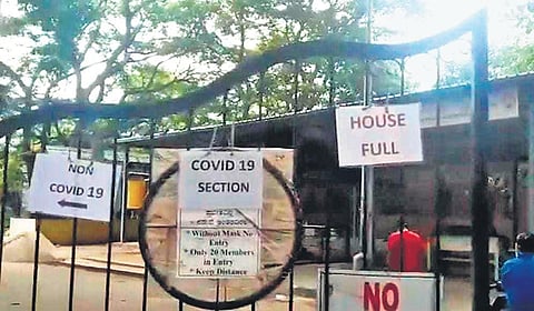 A crematorium in Chamarajpet has put up a ‘House Full’ board on its gate, in Bengaluru on Monday | Shriram BN