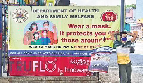 A banner put up at KR Market to create awareness among people on the importance of wearing face masks to control the spread of coronavirus | Shriram BN