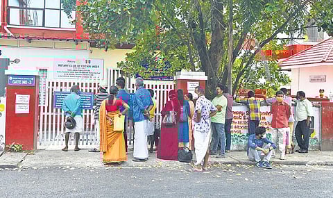 Flouting social distancing norms, people gather in front of Ernakulam General Hospital to give their swab samples for Covid test on Monday | Albin Mathew