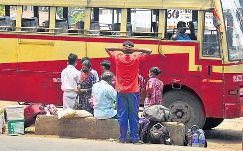 Migrant workers waiting for the bus at the KSRTC station, Aluva, Kochi, to return to their homes in northeastern states  | A Sanesh