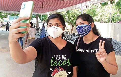Two girls take a selfie after getting the first dose of Covid vaccine at Capital Hospital I Irfana