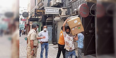 Policemen conduct a raid at Khan Chacha restaurant. (File photo| PTI)