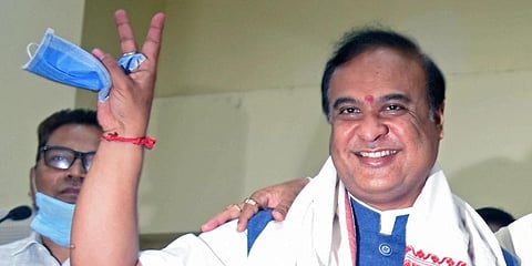 BJP’s Chief Minister designated Himanta Biswa Sarma shows victory signs after being elected party's Legislative party leader in Guwahati on Sunday. (Photo | ANI)